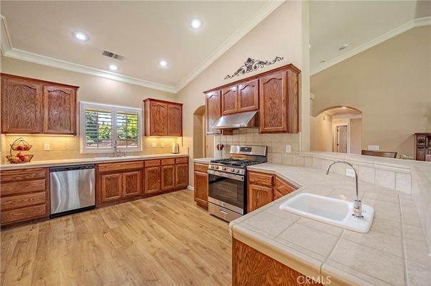 Interior, Kitchen, Recessed Lighting, Stainless Steel Appliances, Tile Countertops, Wood Texture Flooring