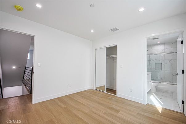 Bathroom, Glass Shower, Interior, Marble, Marble Walls, Recessed Lighting, Wood Texture Flooring