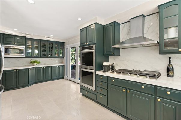 Interior, Kitchen, Marble Walls, Recessed Lighting, Stainless Steel Appliances