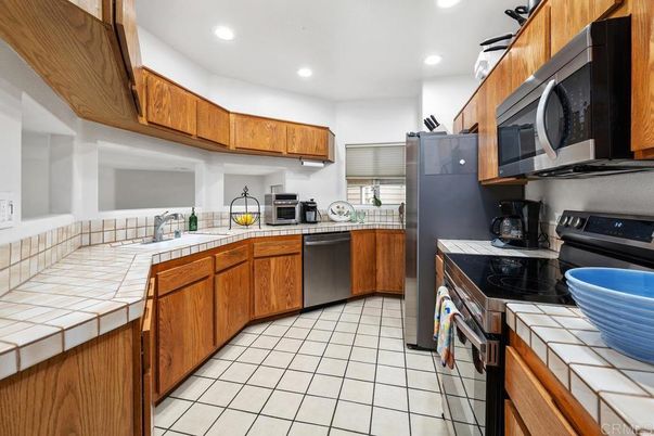Interior, Kitchen, Recessed Lighting, Stainless Steel Appliances, Tile Countertops