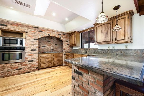 Interior, Kitchen, Pendant Lights, Recessed Lighting, Stainless Steel Appliances, Stone Walls, Wood Texture Flooring