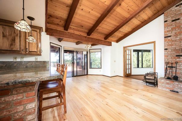 Empty room, Fireplace, Interior, Pendant Lights, Stone Walls, Wooden Beams, Wooden Ceilings, Wood Texture Flooring