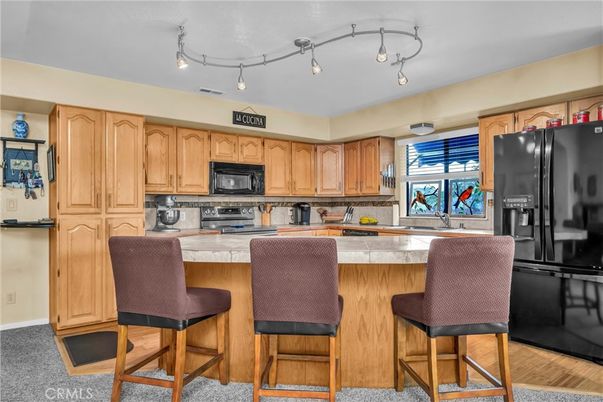 Interior, Kitchen, Tile Countertops, Wood Texture Flooring