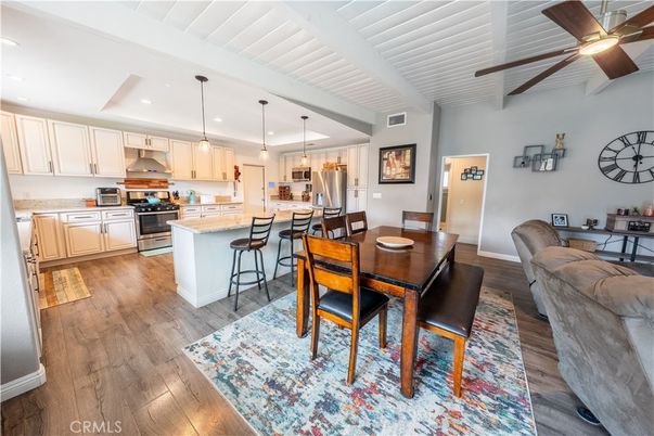 Dining room, Interior, Kitchen, Pendant Lights, Recessed Lighting, Stainless Steel Appliances, Wood Texture Flooring