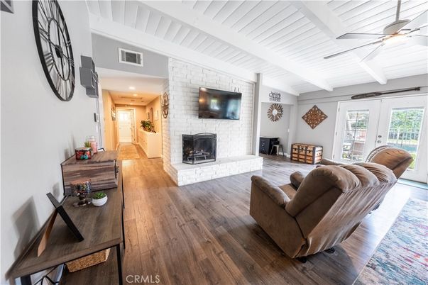 Fireplace, Interior, Living room, Recessed Lighting, Stone Walls, Wood Texture Flooring