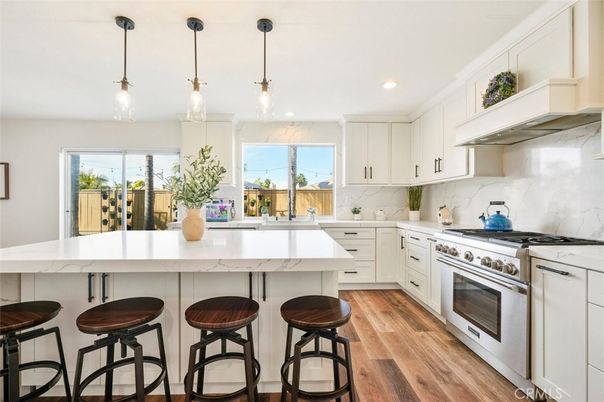 Interior, Kitchen, Marble Walls, Pendant Lights, Recessed Lighting, Stainless Steel Appliances, Wood Texture Flooring