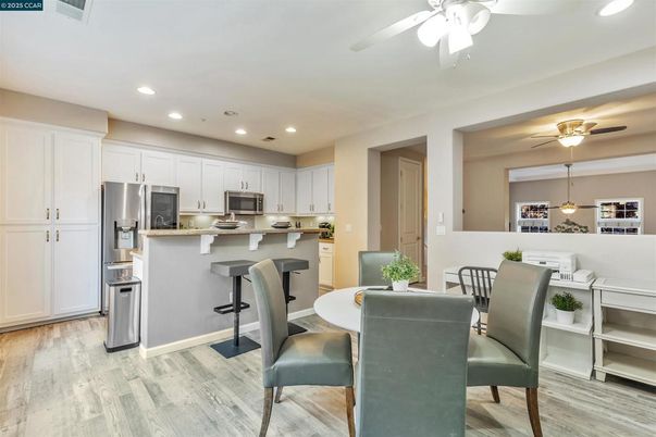 Dining room, Interior, Kitchen, Recessed Lighting, Stainless Steel Appliances, Wood Texture Flooring
