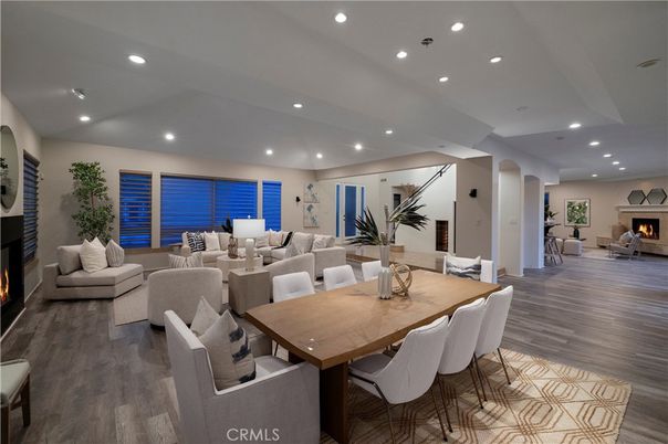 Dining room, Fireplace, Interior, Living room, Recessed Lighting, Wood Texture Flooring