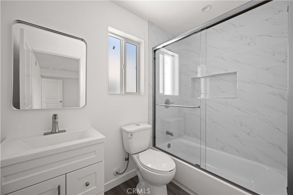 Bathroom, Glass Shower, Interior, Marble Walls, Wood Texture Flooring