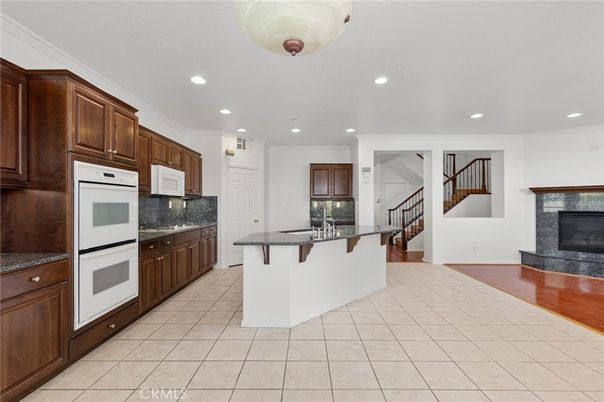 Fireplace, Interior, Kitchen, Recessed Lighting, Wood Texture Flooring
