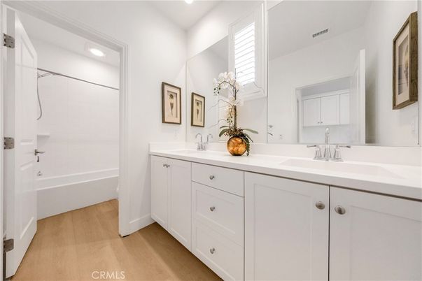 Bathroom, Dual Sink Vanities, Interior, Recessed Lighting, Wood Texture Flooring