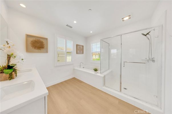 Bathroom, Dual Sink Vanities, Glass Shower, Interior, Recessed Lighting, Wood Texture Flooring