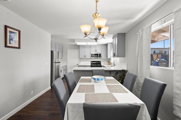 Chandelier, Dining room, Interior, Kitchen, Pendant Lights, Stainless Steel Appliances, Wood Texture Flooring