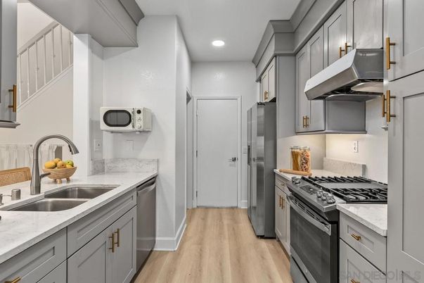 Interior, Kitchen, Recessed Lighting, Stainless Steel Appliances, Wood Texture Flooring