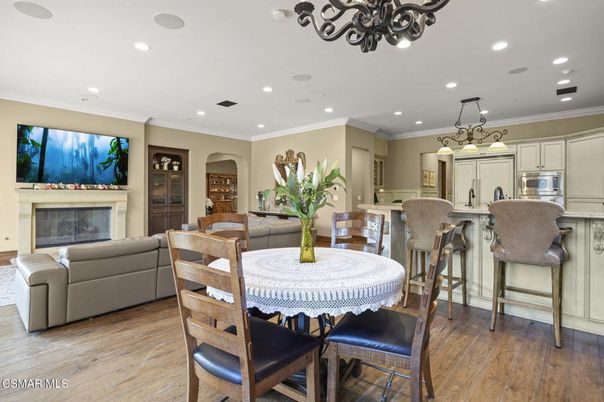 Chandelier, Dining room, Fireplace, Interior, Kitchen, Living room, Recessed Lighting, Wood Texture Flooring