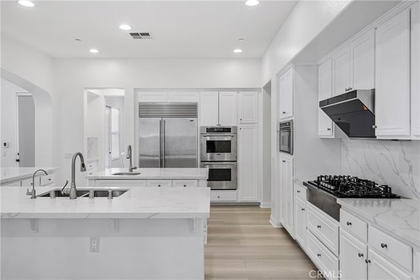 Interior, Kitchen, Marble Walls, Recessed Lighting, Stainless Steel Appliances, Wood Texture Flooring