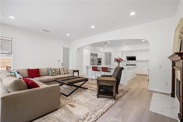 Fireplace, Interior, Kitchen, Living room, Recessed Lighting, Stainless Steel Appliances, Wood Texture Flooring