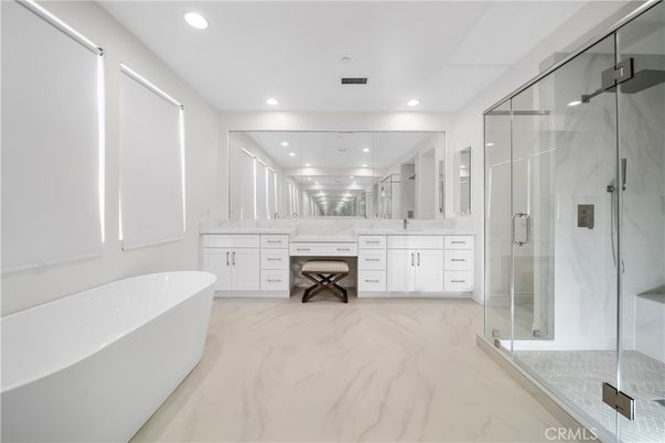 Bathroom, Dual Sink Vanities, Free Standing Baths, Glass Shower, Interior, Marble, Marble Walls, Recessed Lighting