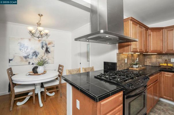 Chandelier, Dining room, Interior, Kitchen, Tile Countertops, Wood Texture Flooring