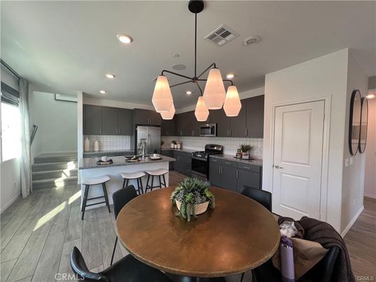 Dining room, Interior, Kitchen, Pendant Lights, Recessed Lighting, Stainless Steel Appliances, Wood Texture Flooring