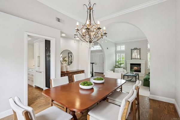 Chandelier, Dining room, Fireplace, Interior, Living room, Recessed Lighting, Wood Texture Flooring