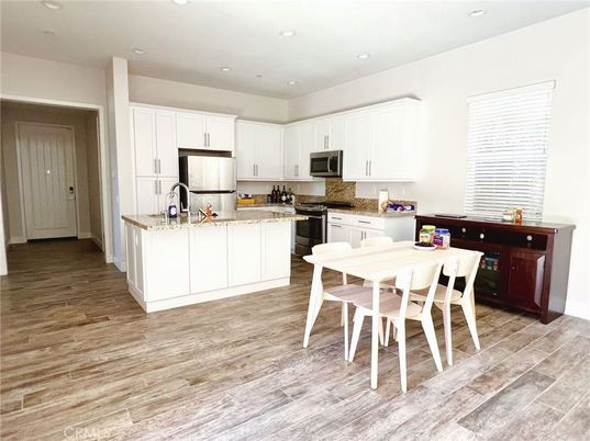 Dining room, Interior, Kitchen, Recessed Lighting, Stainless Steel Appliances, Wood Texture Flooring