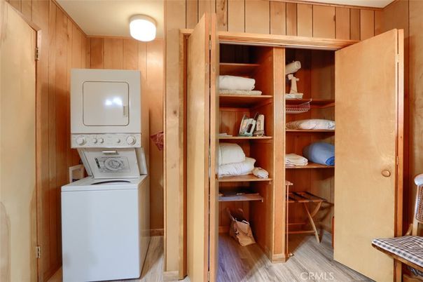 Interior, Utility Closets, Washer, Wood Texture Flooring, Wooden Walls