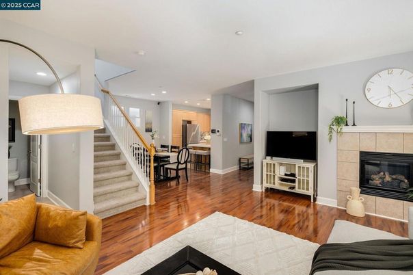 Dining room, Fireplace, Interior, Living room, Recessed Lighting, Wood Texture Flooring