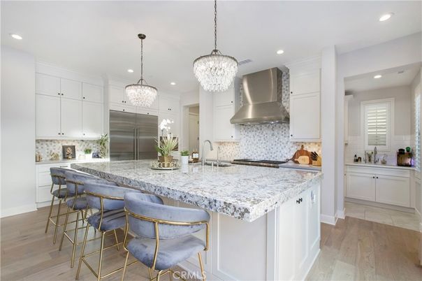 Chandelier, Interior, Kitchen, Pendant Lights, Recessed Lighting, Stainless Steel Appliances, Wood Texture Flooring