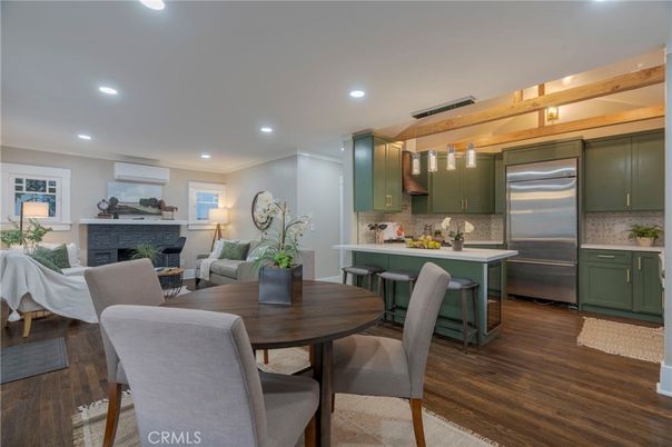 Dining room, Fireplace, Interior, Kitchen, Living room, Recessed Lighting, Stainless Steel Appliances, Wood Texture Flooring