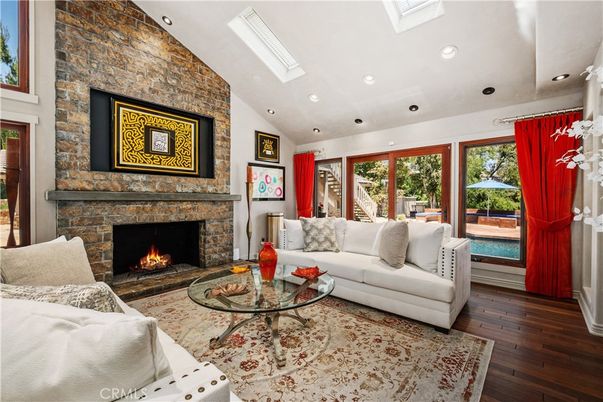 Fireplace, Interior, Living room, Recessed Lighting, Stone Walls, Wood Texture Flooring