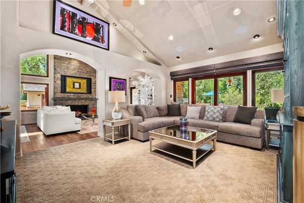 Fireplace, Interior, Living room, Recessed Lighting, Stone Walls, Wood Texture Flooring