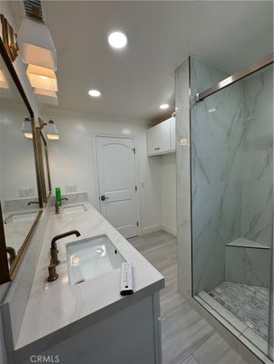 Bathroom, Glass Shower, Interior, Marble Walls, Recessed Lighting, Wood Texture Flooring