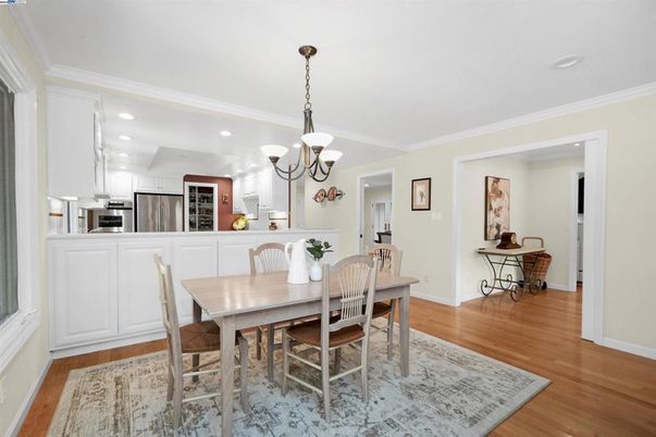 Chandelier, Dining room, Interior, Kitchen, Recessed Lighting, Stainless Steel Appliances, Wood Texture Flooring