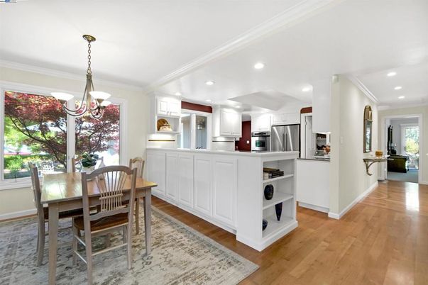 Chandelier, Dining room, Interior, Kitchen, Pendant Lights, Recessed Lighting, Stainless Steel Appliances, Wood Texture Flooring
