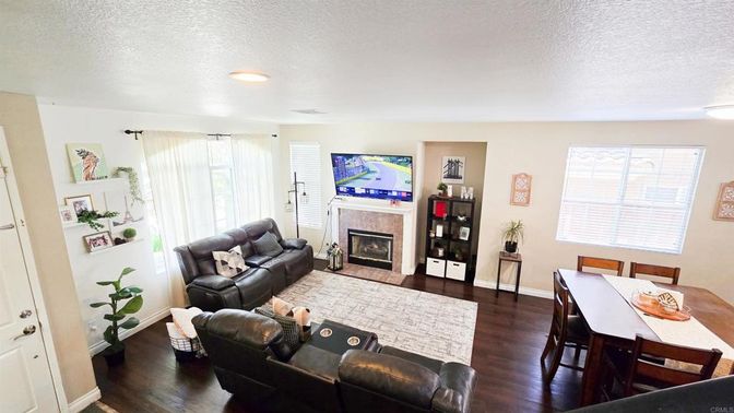 Dining room, Fireplace, Interior, Living room, Recessed Lighting, Wood Texture Flooring