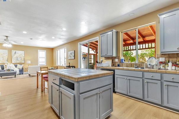 Dining room, Interior, Kitchen, Living room, Recessed Lighting, Tile Countertops, Wood Texture Flooring