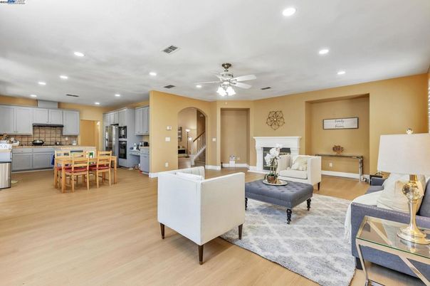 Dining room, Fireplace, Interior, Kitchen, Living room, Recessed Lighting, Stainless Steel Appliances, Wood Texture Flooring
