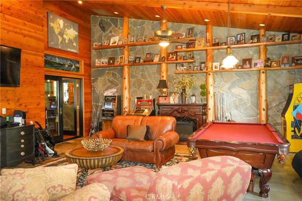 Billiard Table, Fireplace, Game Room, Interior, Living room, Recessed Lighting, Stone Walls, Wooden Beams, Wooden Ceilings, Wooden Walls