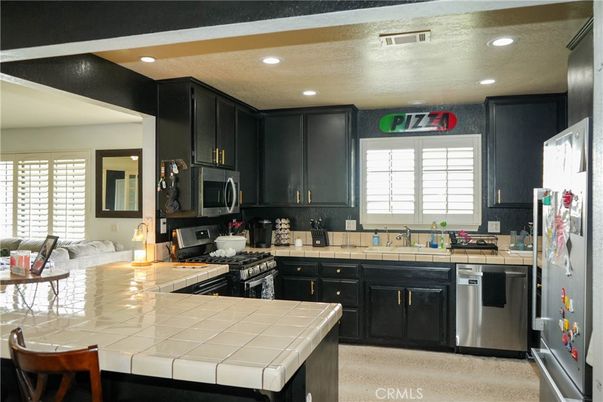 Interior, Kitchen, Recessed Lighting, Stainless Steel Appliances, Tile Countertops