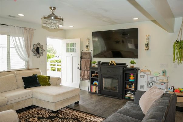 Chandelier, Fireplace, Interior, Living room, Recessed Lighting, Wood Texture Flooring