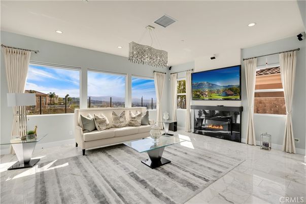 Chandelier, Fireplace, Interior, Living room, Marble, Recessed Lighting