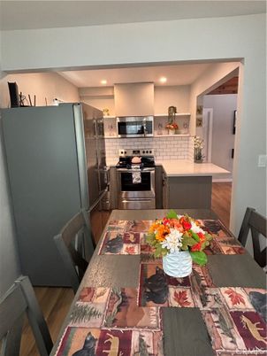 Dining room, Interior, Kitchen, Recessed Lighting, Stainless Steel Appliances, Wood Texture Flooring