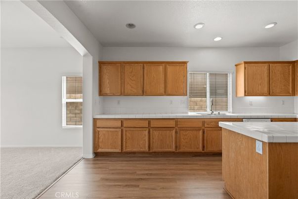 Interior, Kitchen, Recessed Lighting, Tile Countertops, Wood Texture Flooring