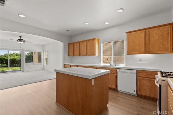 Interior, Kitchen, Recessed Lighting, Tile Countertops, Wood Texture Flooring
