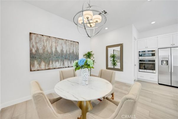 Chandelier, Dining room, Interior, Kitchen, Recessed Lighting, Stainless Steel Appliances, Wood Texture Flooring