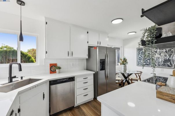Dining room, Interior, Kitchen, Pendant Lights, Recessed Lighting, Stainless Steel Appliances, Wood Texture Flooring