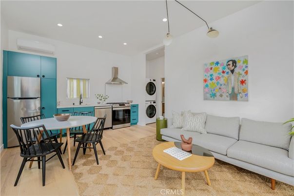 Dining room, Interior, Kitchen, Living room, Pendant Lights, Recessed Lighting, Stainless Steel Appliances, Washer, Wood Texture Flooring