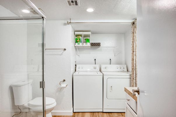 Bathroom, Glass Shower, Interior, Recessed Lighting, Utility Closets, Washer, Wood Texture Flooring
