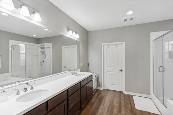 Bathroom, Dual Sink Vanities, Glass Shower, Interior, Recessed Lighting, Wood Texture Flooring